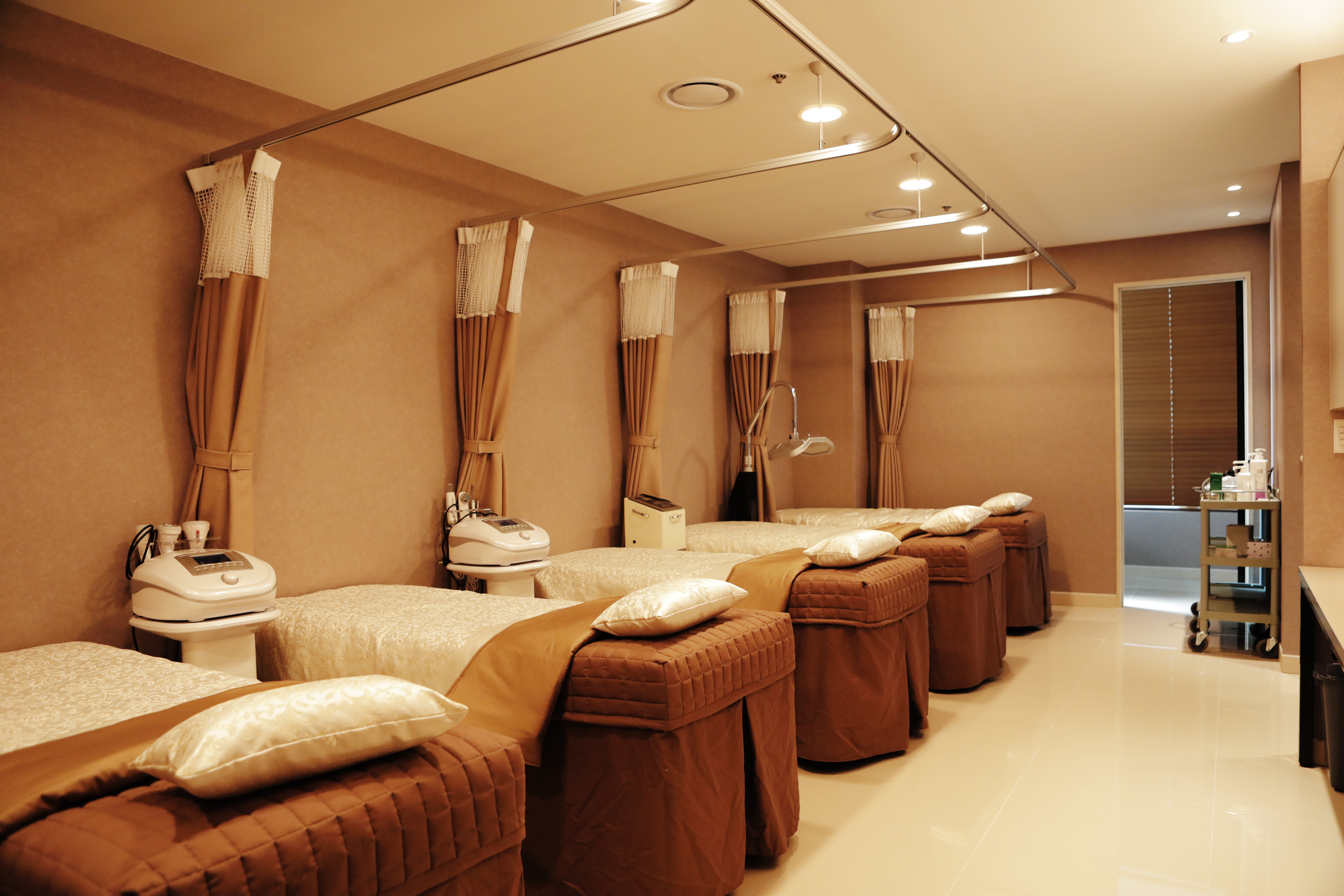 Treatment room with beds and equipment at Mienmi Clinic